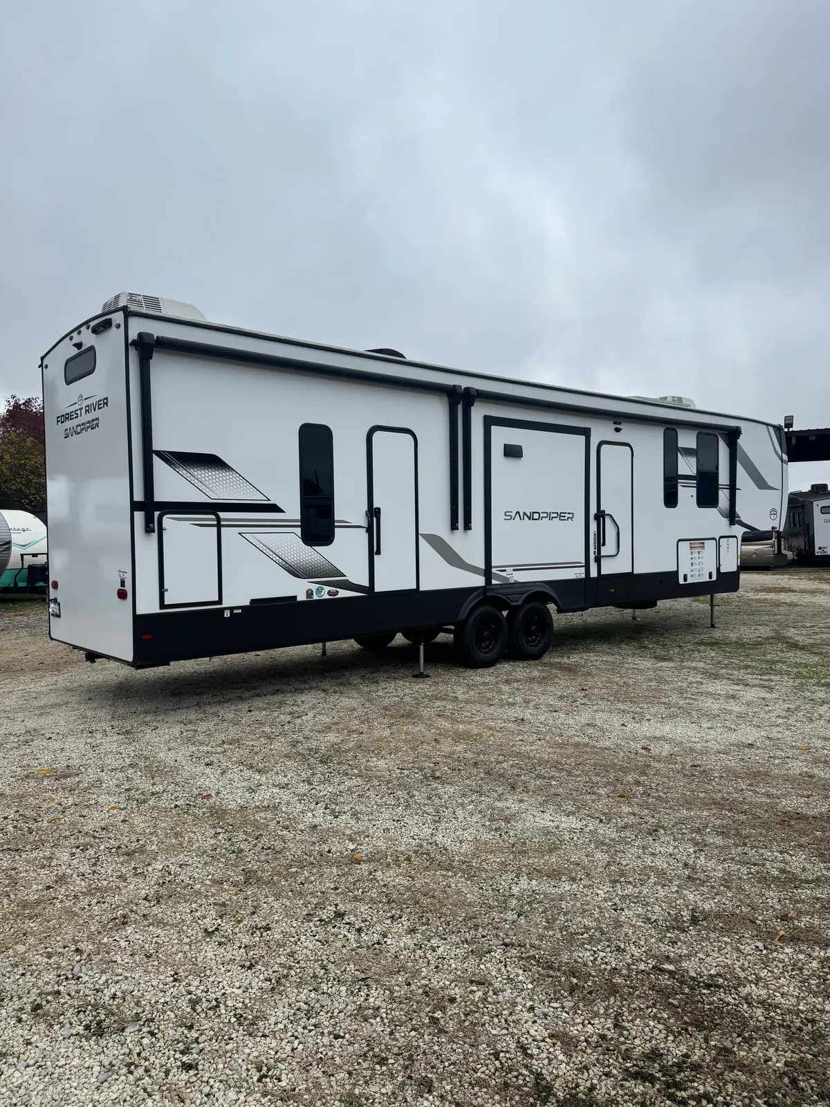 Exterior of the 2025 Forest River Sandpiper 3550BH fifth wheel at Four Wide Storage
